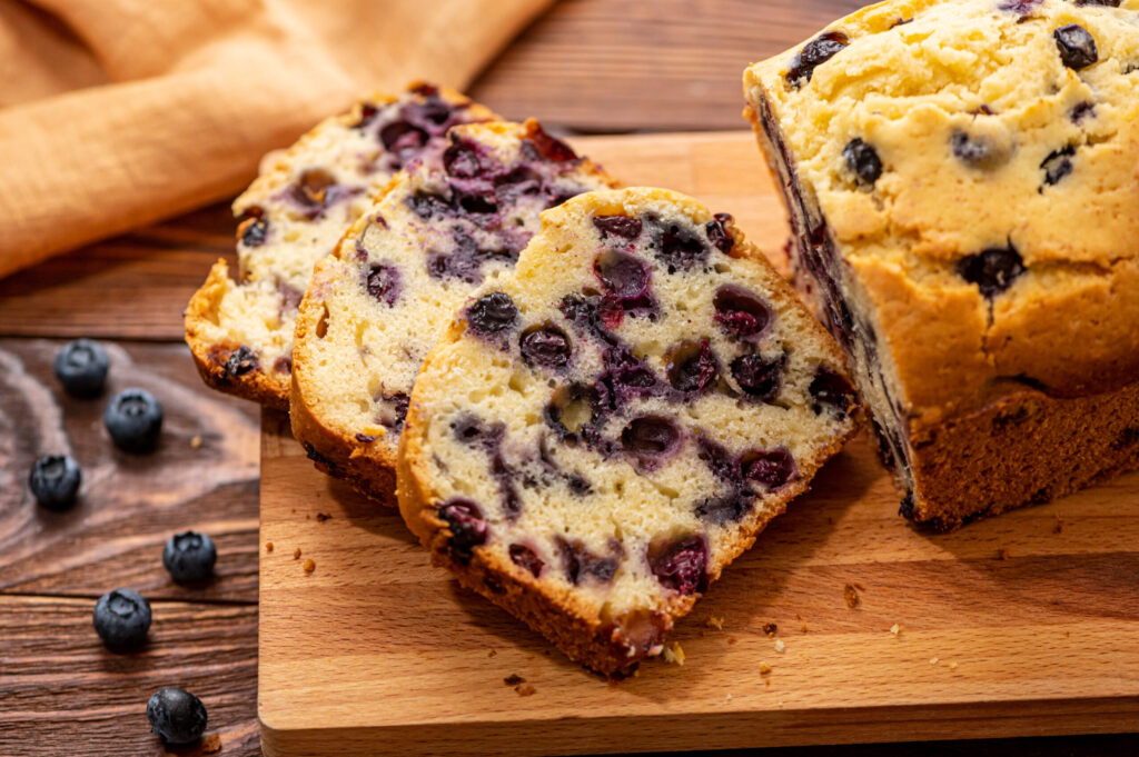 slices of moist quick bread with berries throughout