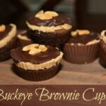 layered brownie, peanut butter, and chocolate in muffin cups
