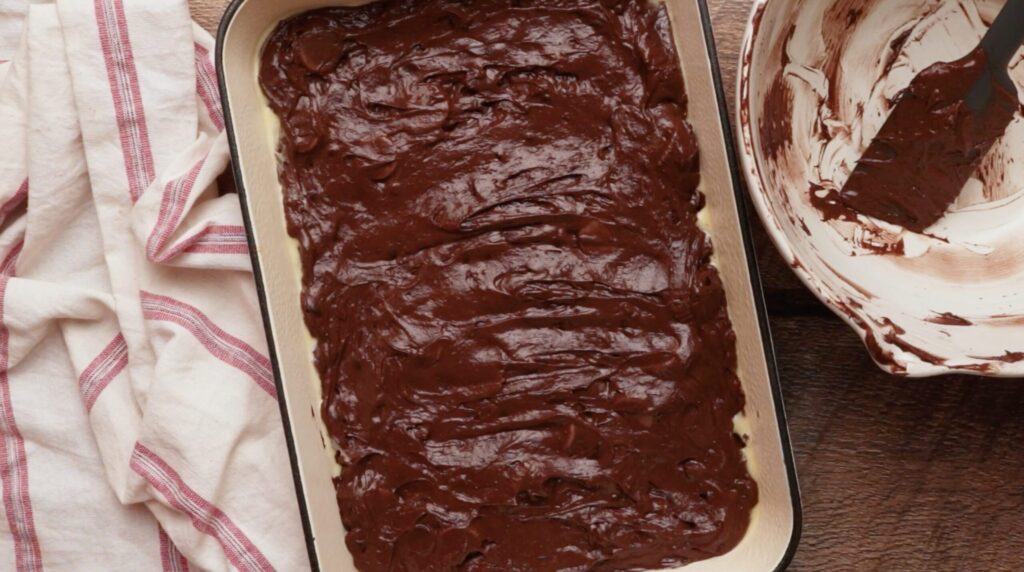 chocolate batter spread evenly into a baking pan.