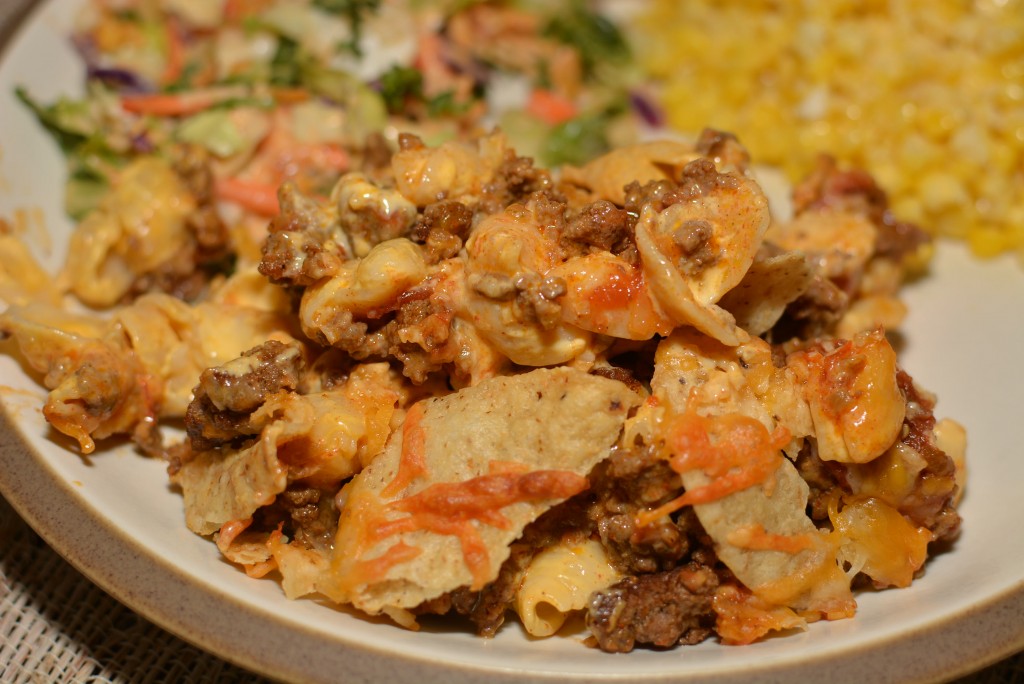 a scoop of macaroni nacho casserole on a plate