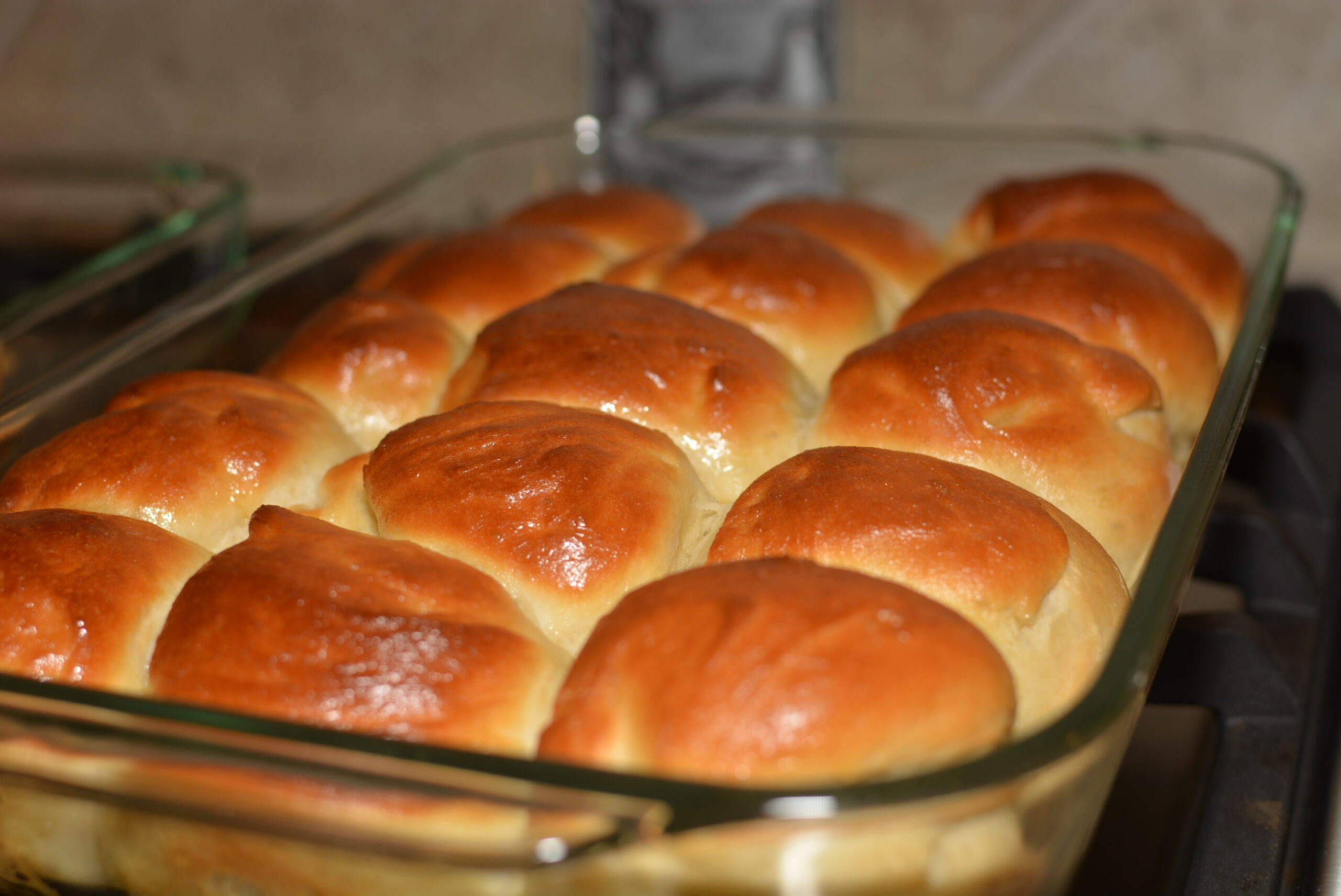 fluffy dinner rolls baked in a 9x13 baking dish and ready to enjoy.