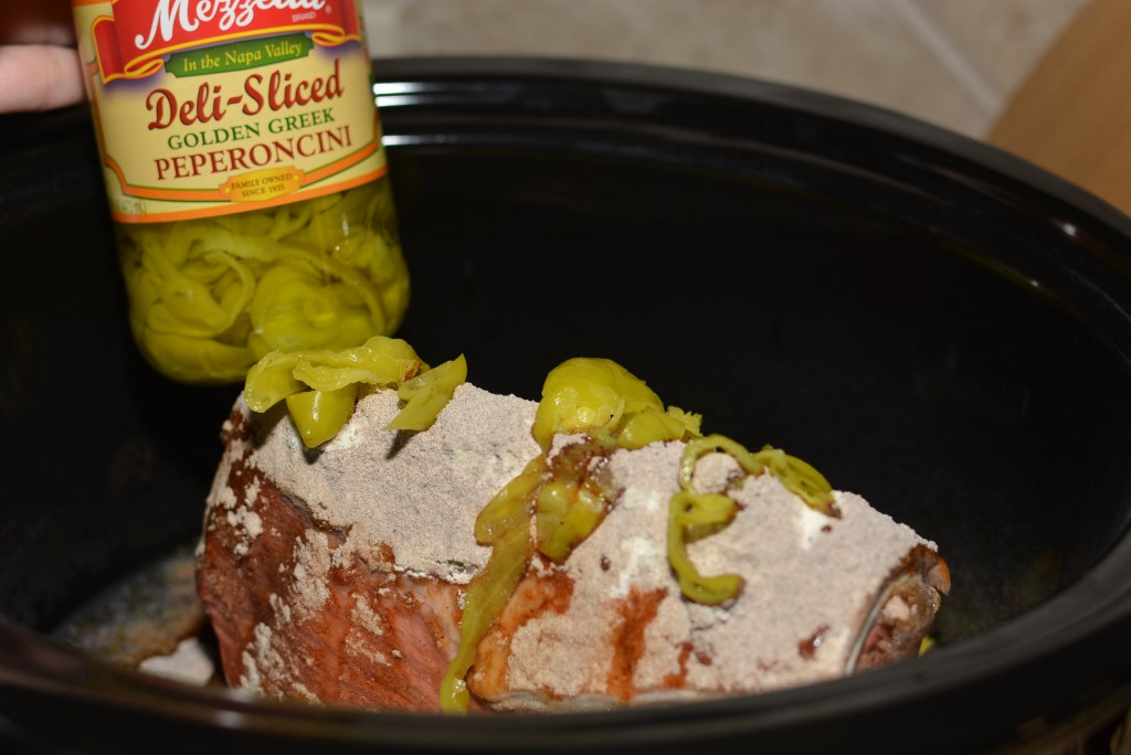 peperoncini slices over a chuck roast in the slow cooker 