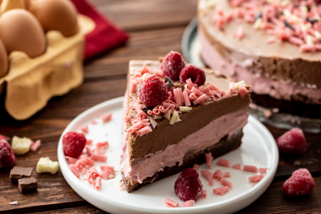 layers of cake and mousse combined into a raspberry chocolate favorite