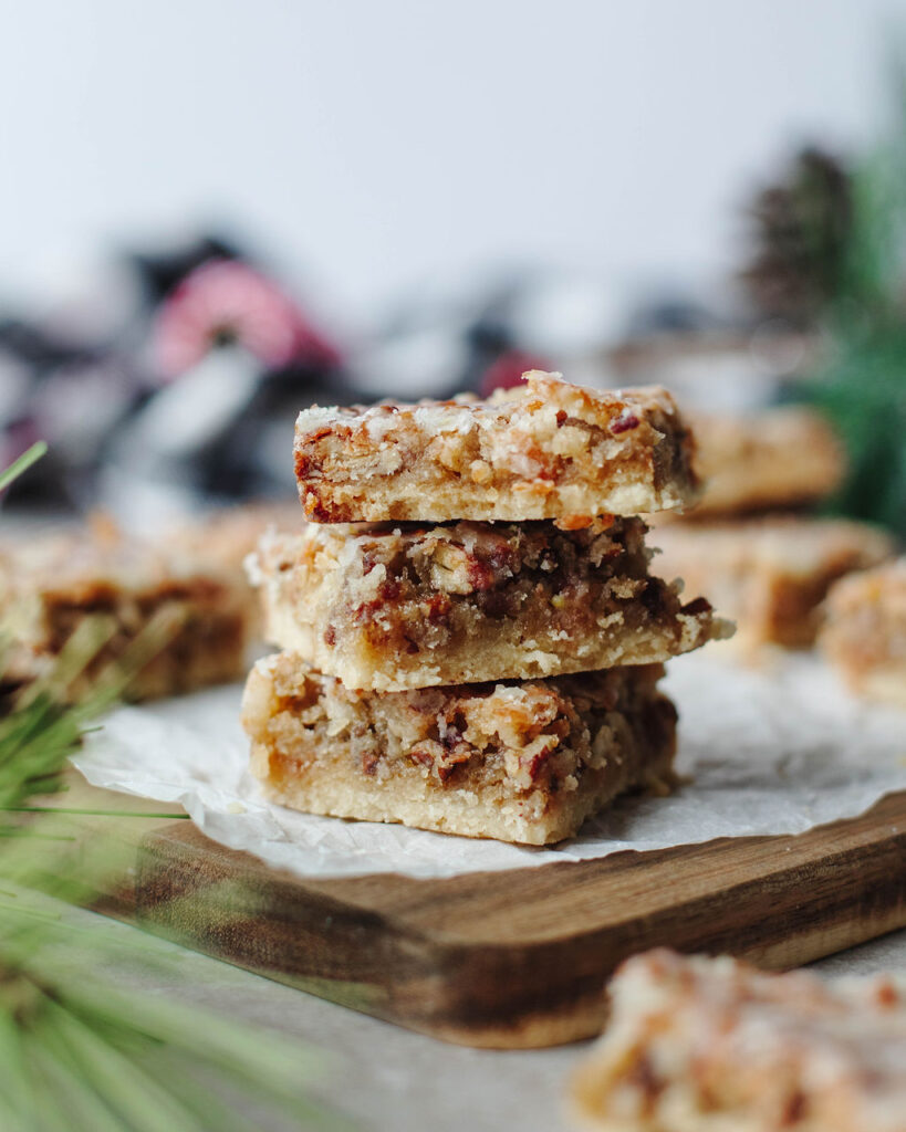 a stack of Christmas bars on a wood board.