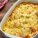 Chicken pot pie bubble up casserole in a white baking dish.