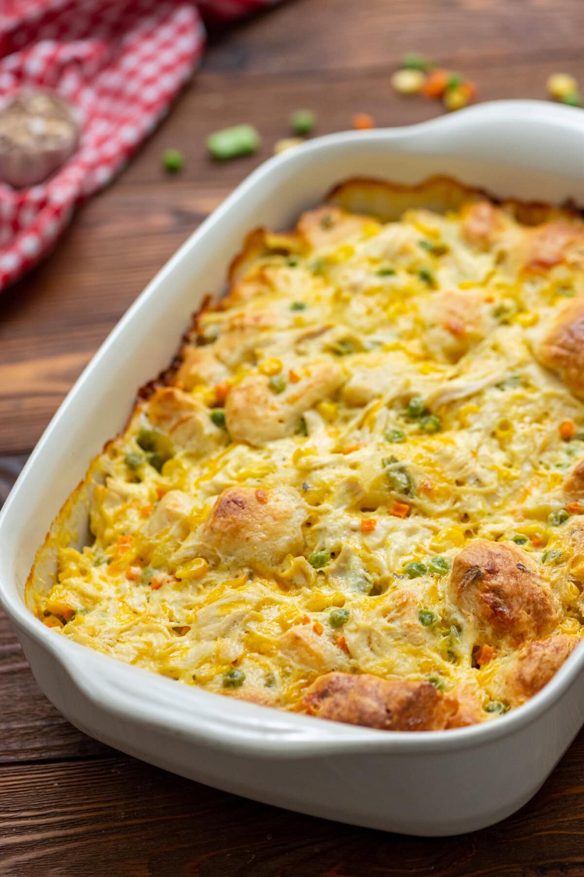 Chicken pot pie bubble up casserole in a white baking dish.