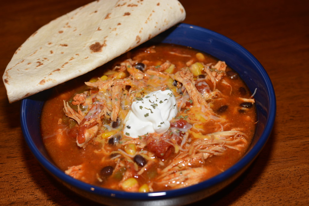 shredded chicken, corn, beans, tomatoes, and seasonings combined into a flavorful soup