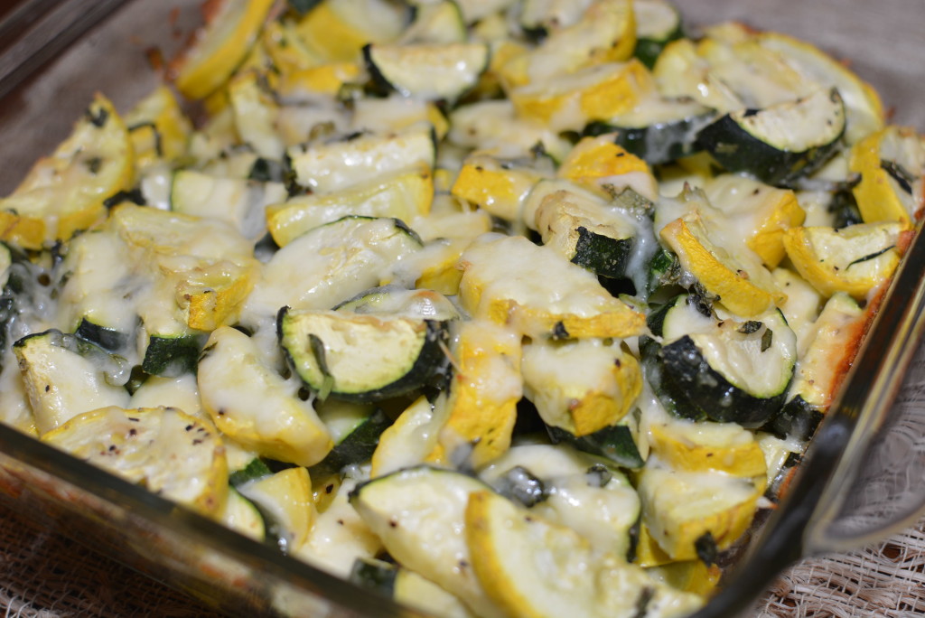 melted cheese over baked squash and zucchini make this a cheesy zucchini bake