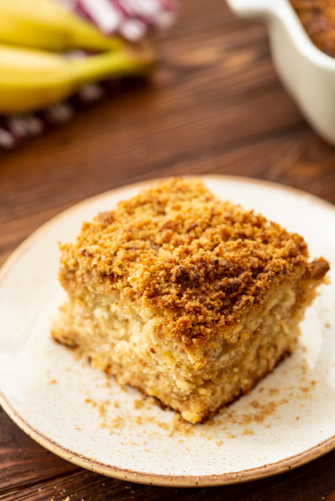 fluffy cake with bananas and a cinnamon crumb topping in every bite