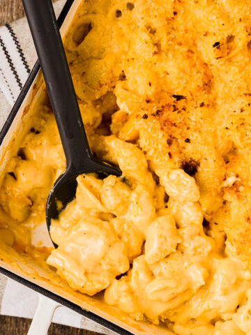 scooping into creamy mac and cheese