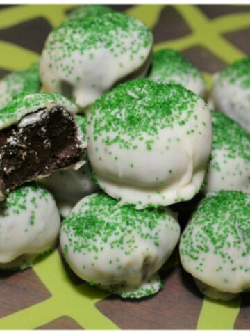 chocolate covered oreo balls decorated for st. patrick's day