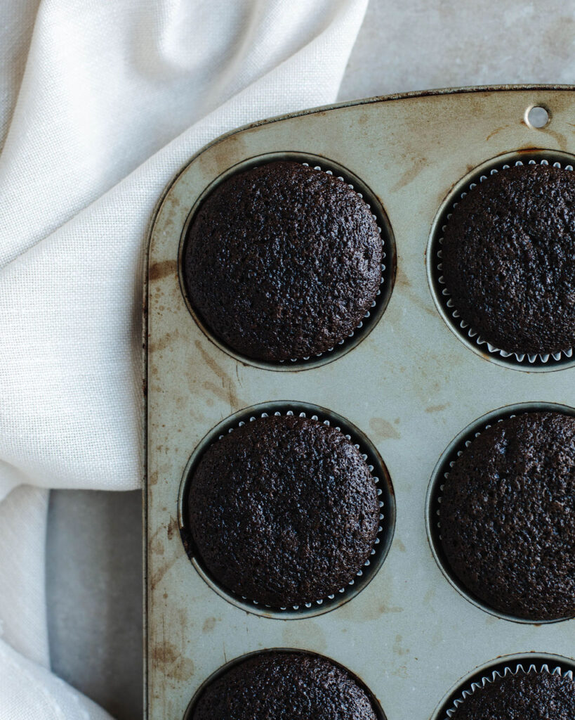 chocolate cupcakes in a muffin tray.