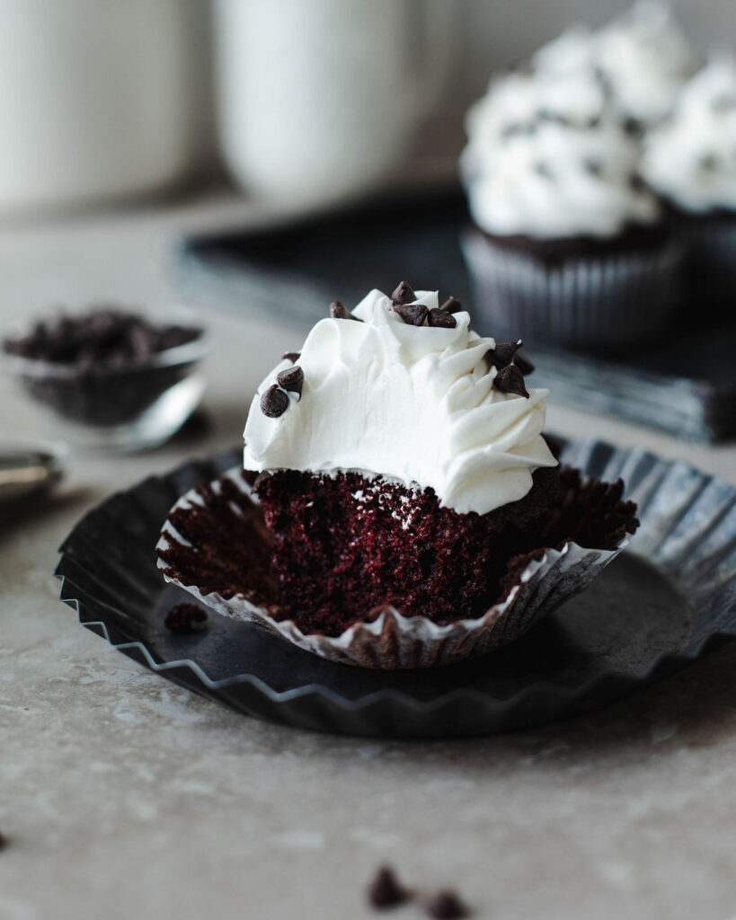 a chocolate cupcake with a peeled liner ready to serve.