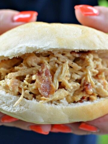 Slow Cooker Crack Chicken served as a sandwich.