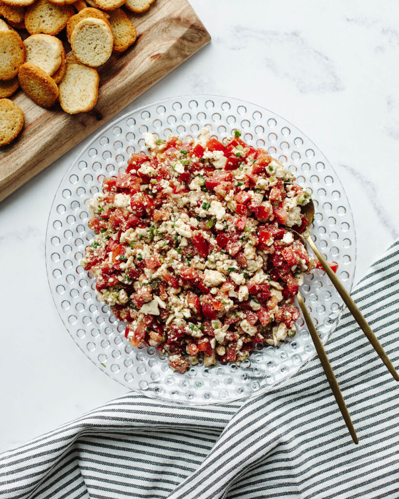 Tomato Feta Dip combined in a glass bowl.