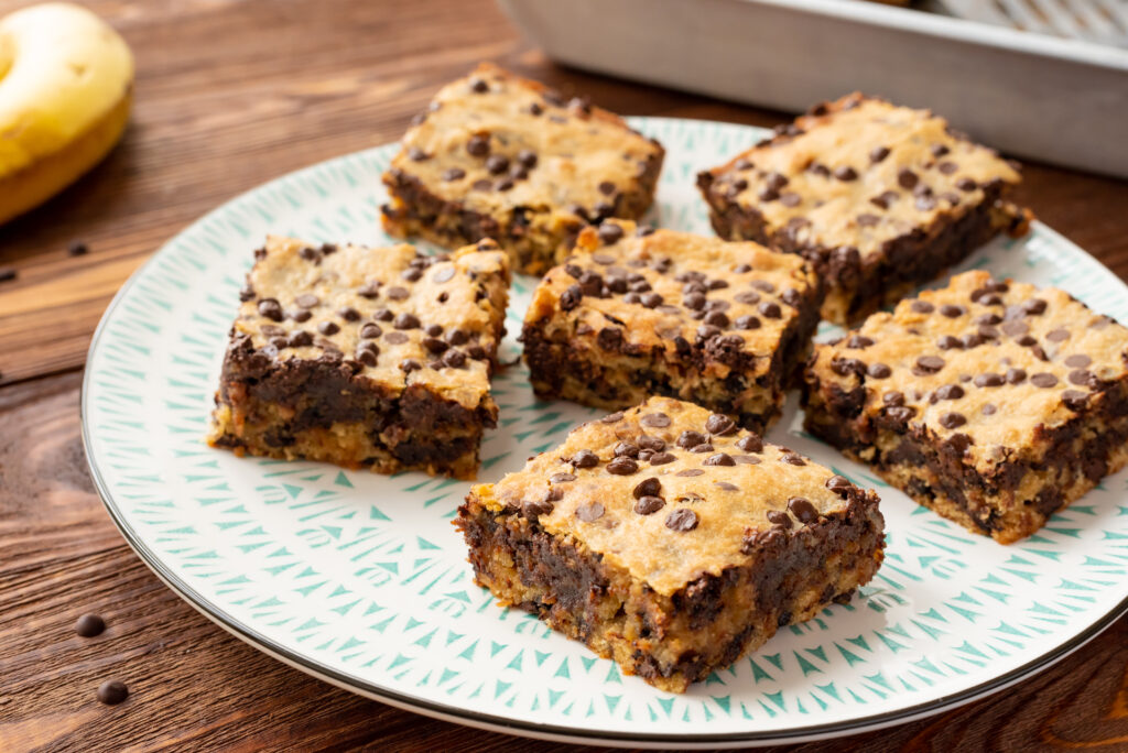 fresh chunky monkey brownies cut and served on a plate