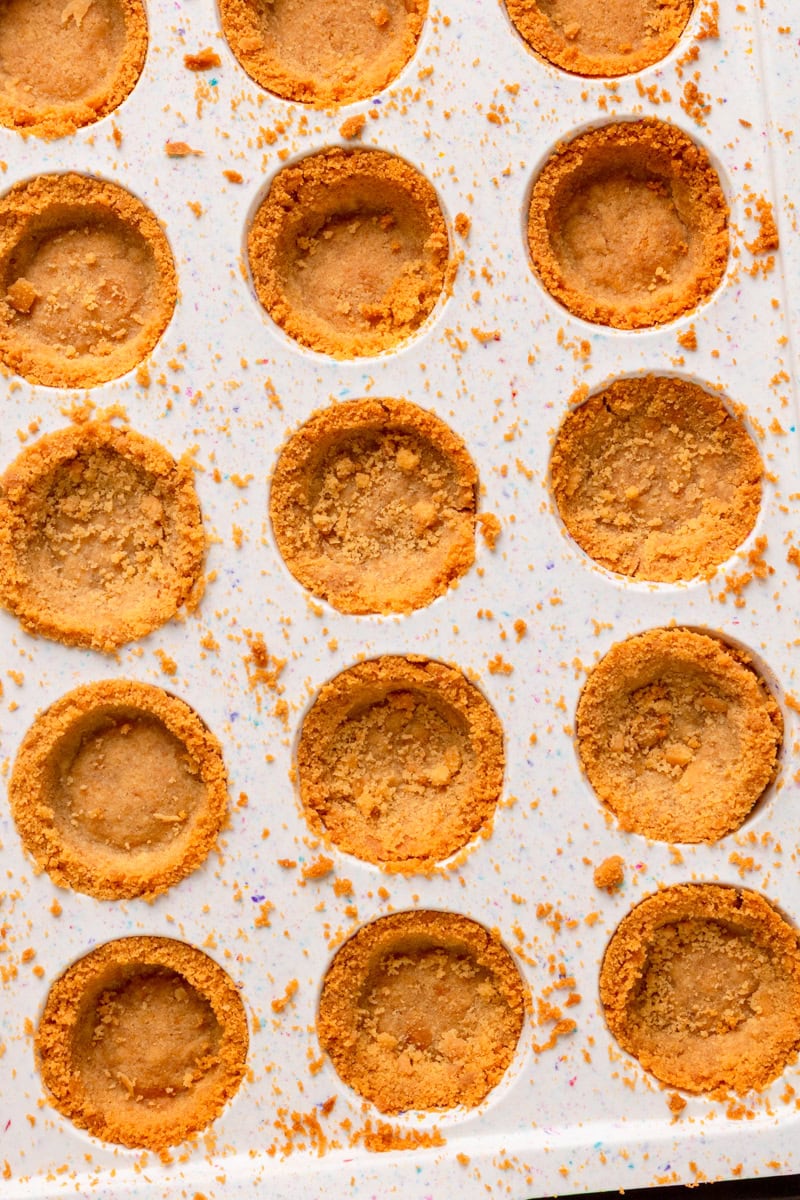 a baked cookie crust in a muffin pan ready to use as a crust.