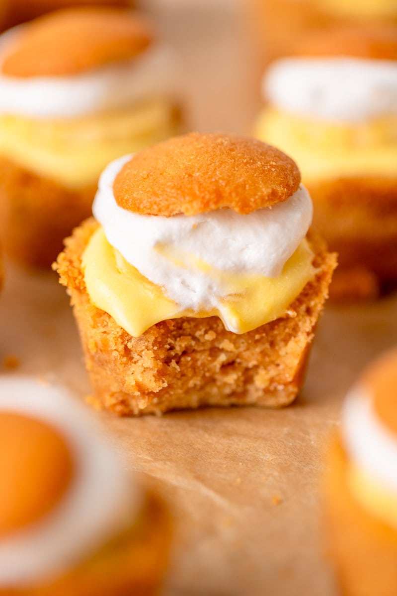 Close-up of an individual banana cream pie bite showing creamy filling and cookie crust.