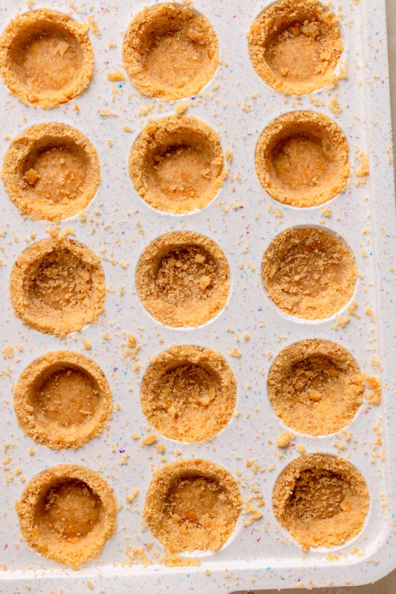 Mini muffin pan with Nilla Wafers pressed into the bottom to create pie crusts.