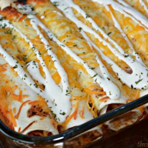 shredded chicken in flour tortillas with cheese and ranch on top