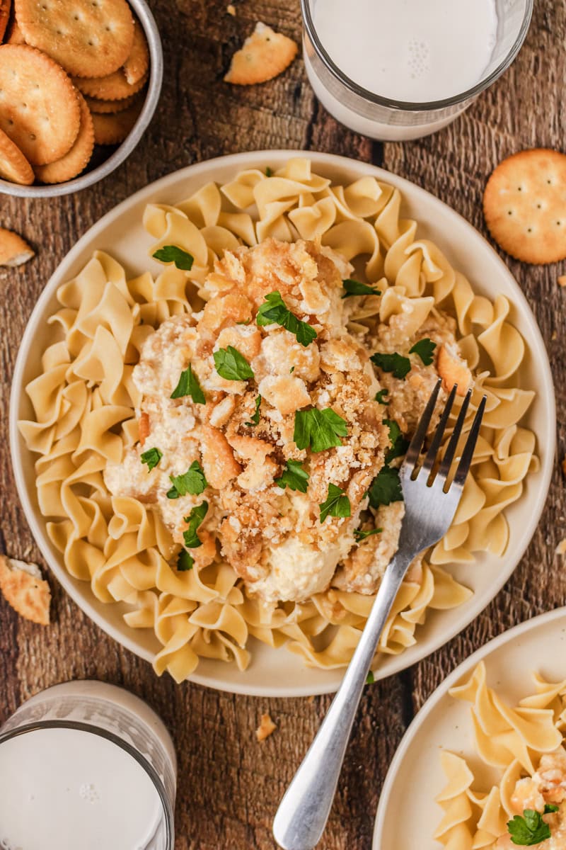 Tender chicken, pasta, ritz cracker crumbs, and seasonings combined in a bowl.