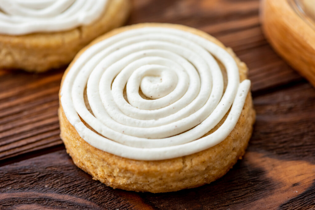 sugar cookies that have a cinnamon roll frosting on top