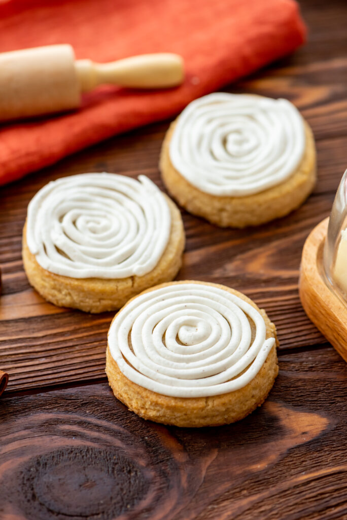 cinnamon roll frosted sugar cookies that are packed with flavor