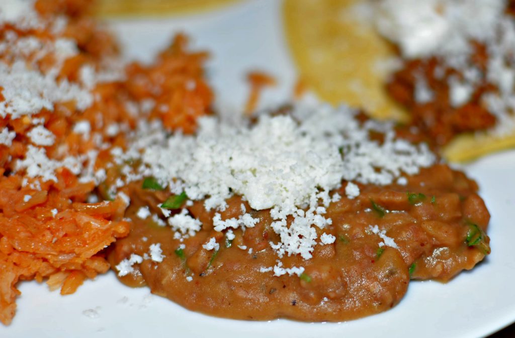 The Best refried beans topped with fresh cotija cheese