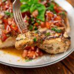grilled chicken marinated and topped with a tomato, basil, onion mixture