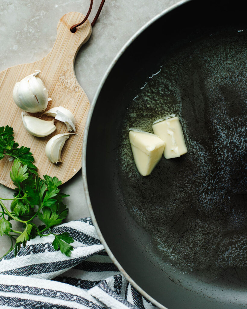 melted butter in a black skillet.