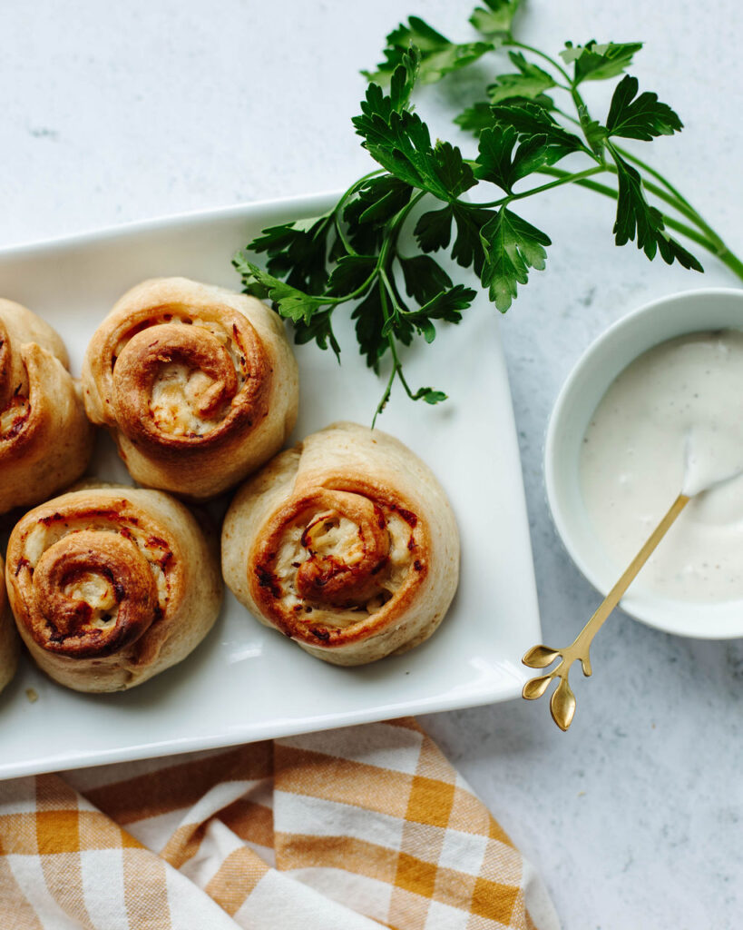 ranch chicken rollups on a white plate.