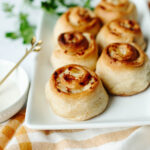 golden brown crescent rolls baked with a chicken cheese mixture inside.