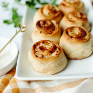 golden brown crescent rolls baked with a chicken cheese mixture inside.