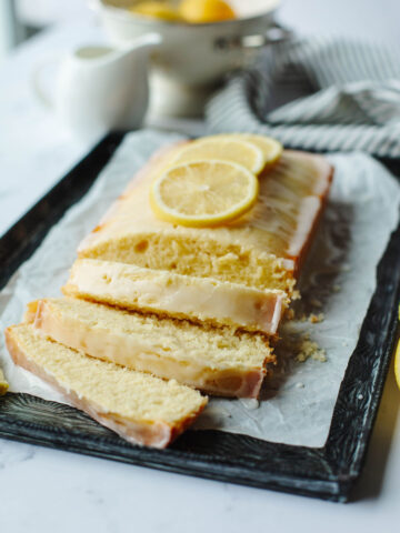 sliced lemon loaf on a cutting board.