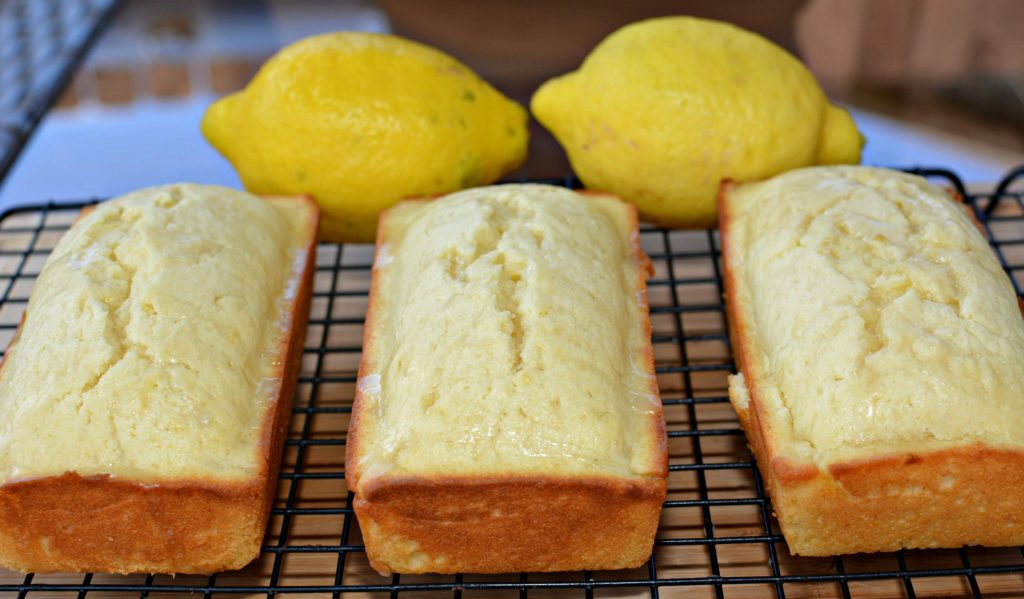 Warm lemon bread cooling on the cooling rack.