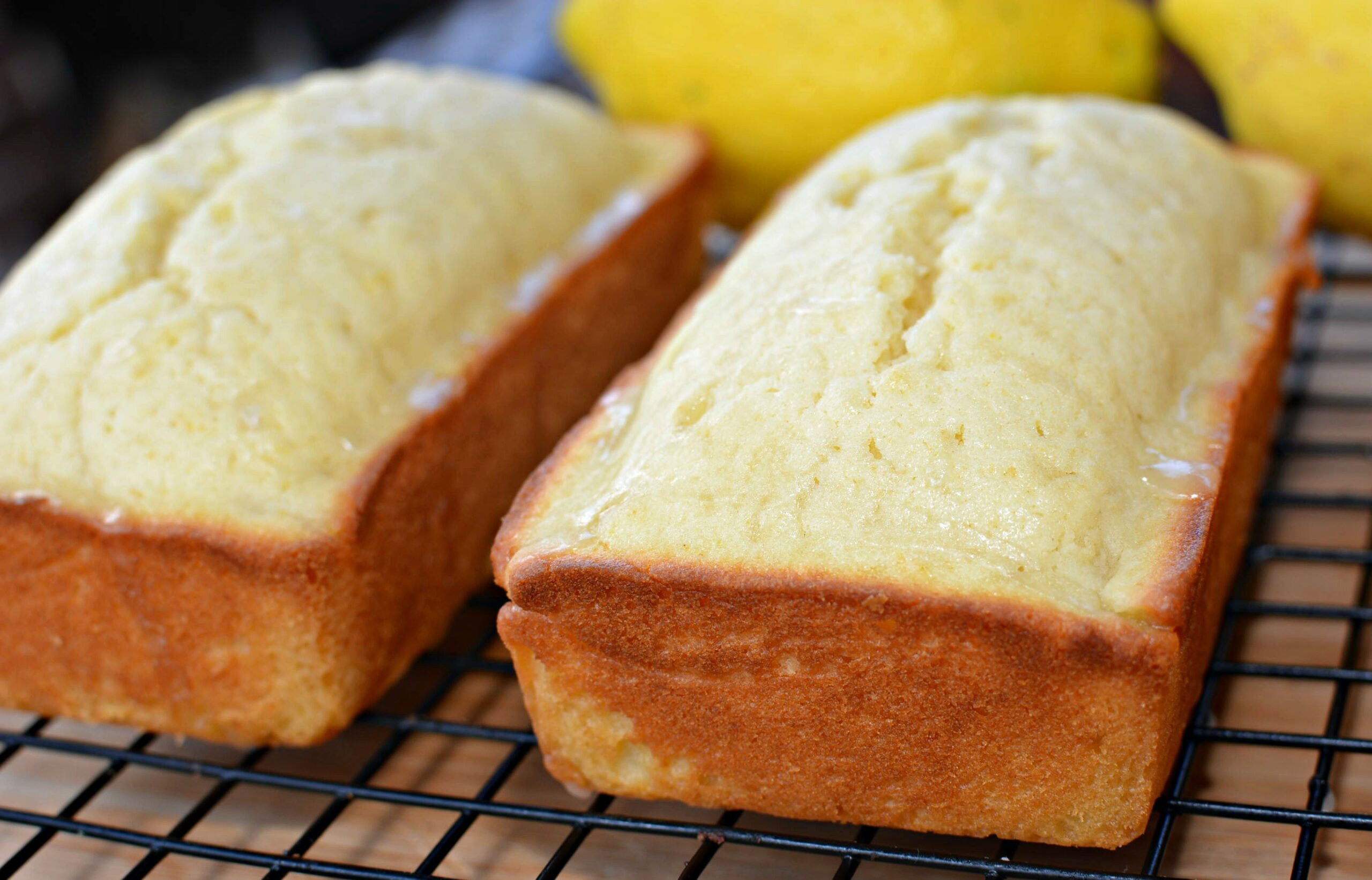 baked lemon bread cooling on a wire rack.