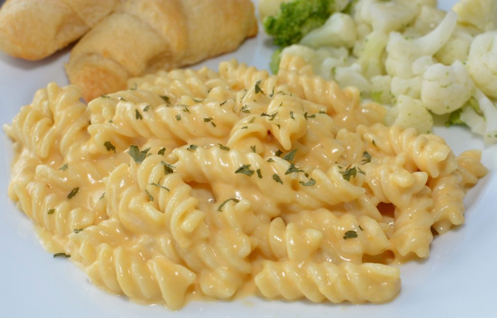 creamy cheese sauce coated over tender pasta