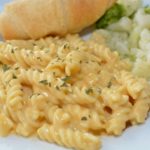 cooked macaroni noodles with a cheese sauce
