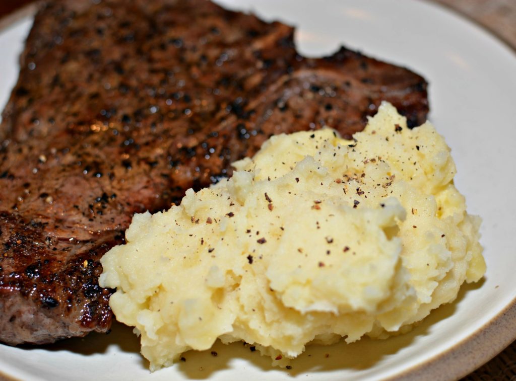 fluffy instant pot potatoes with garlic throughout