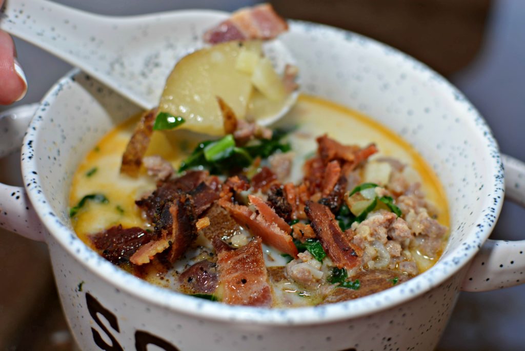 crumbled bacon on top of zuppa toscana soup cooked in the instant pot