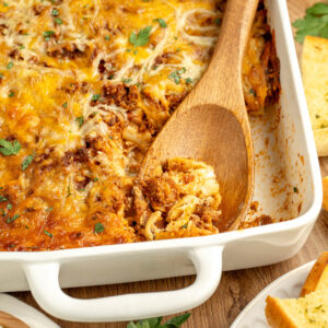 a cheesy pasta dish with ground beef, tomato sauce, noodles, and seasonings.