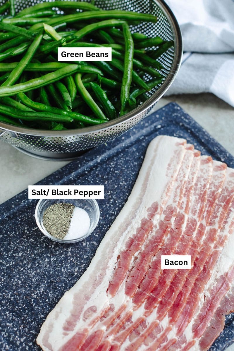 Green beans and bacon ingredients laid out on kitchen counter before cooking