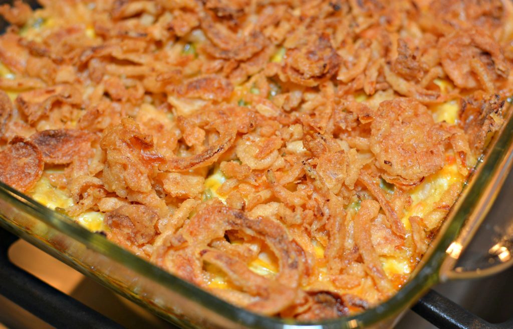 tender, shredded chicken in a casserole with onions, cheese, green beans and more