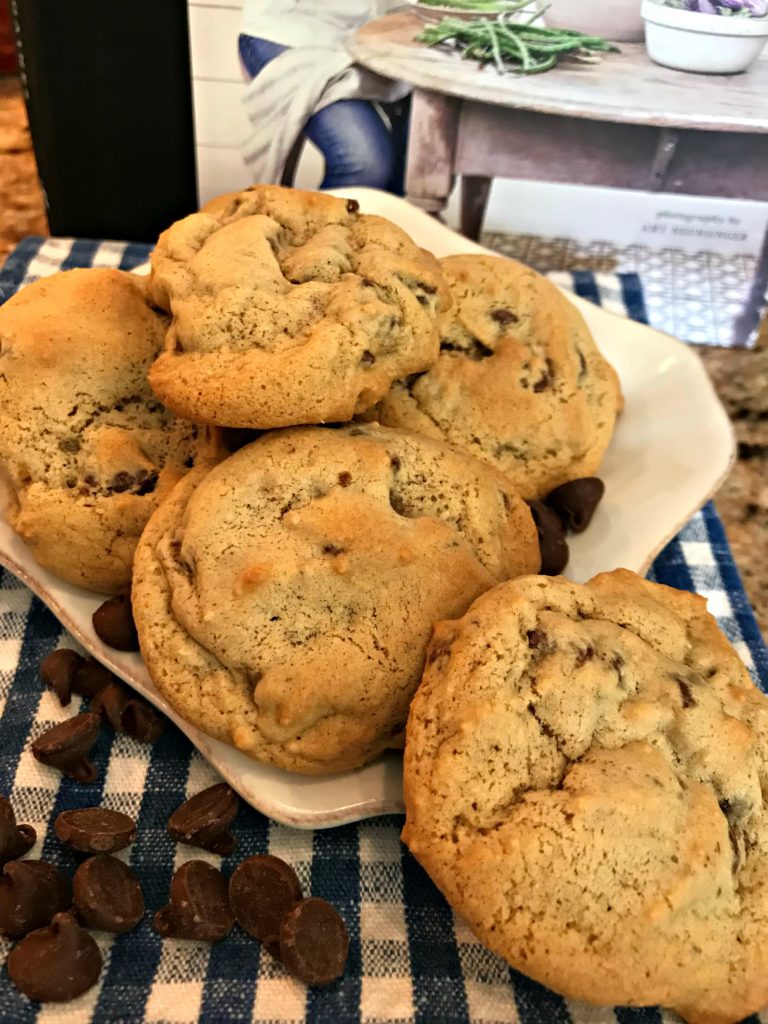 Warm chewy chocolate chip cookies on a plate ready to eat