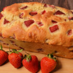 a large loaf of quick bread with strawberries