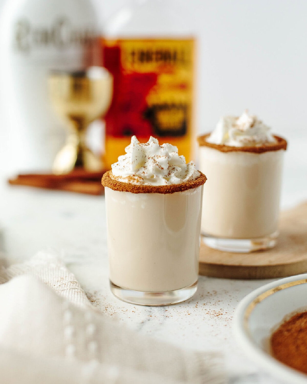 creamy cinnamon crunch shots with whipped cream.