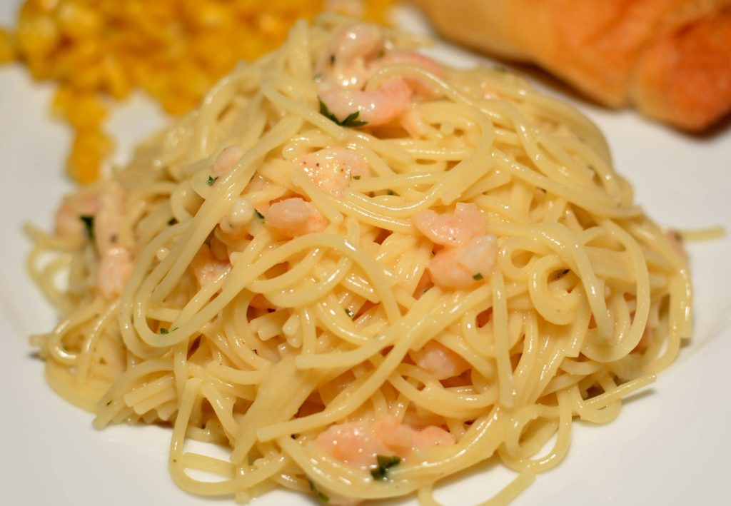 tender pasta covered in a lemon garlic cream sauce with shrimp throughout