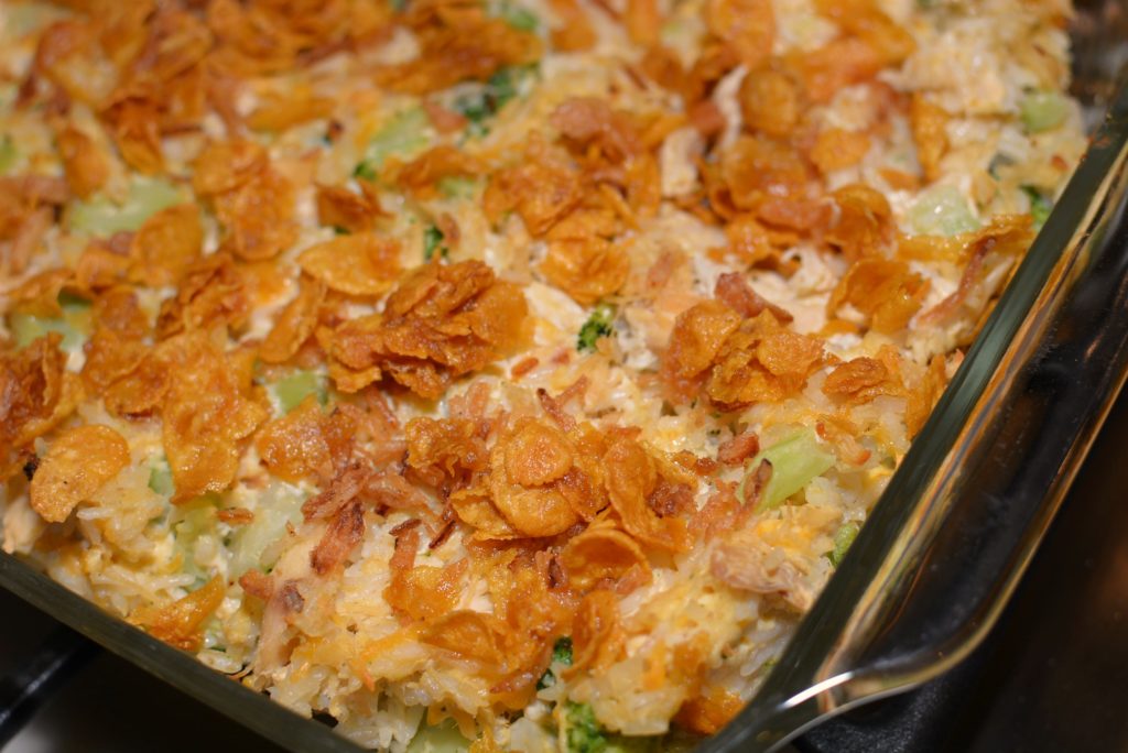 shredded chicken combined with cooked broccoli and rice in a one pan dish