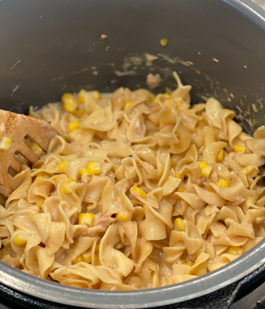 tender noodles combined with tuna and cheese to form a casserole 