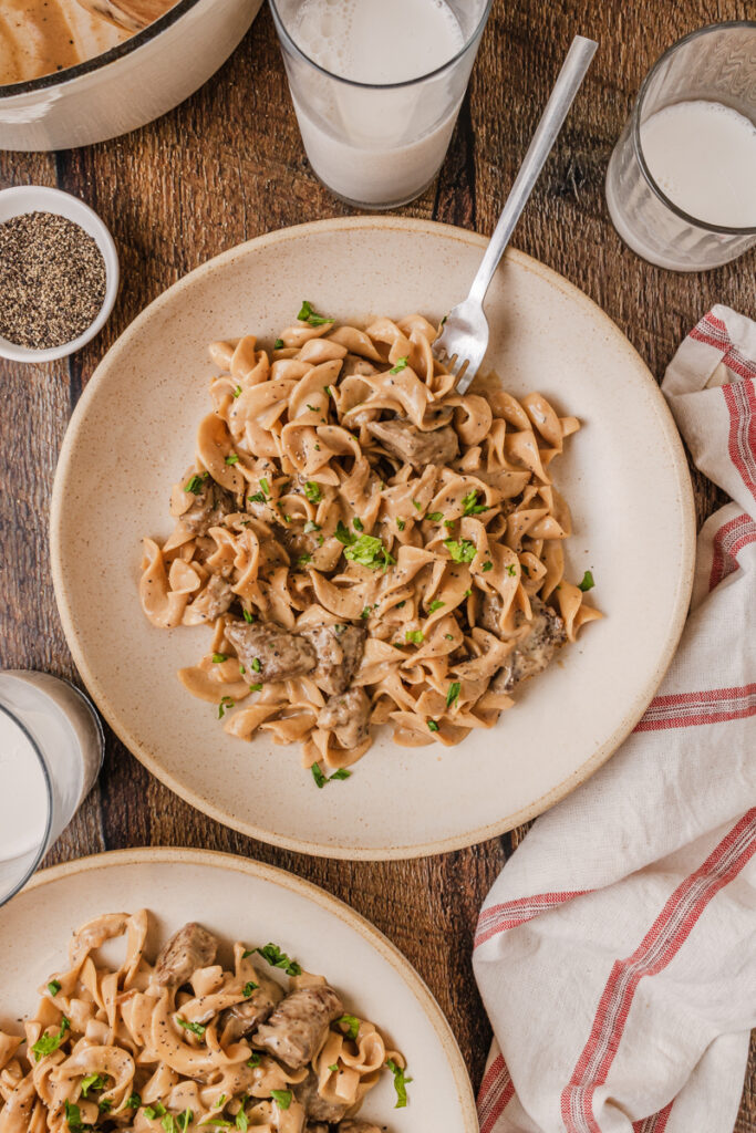 creamy french onion beef and noodles served on a plate.